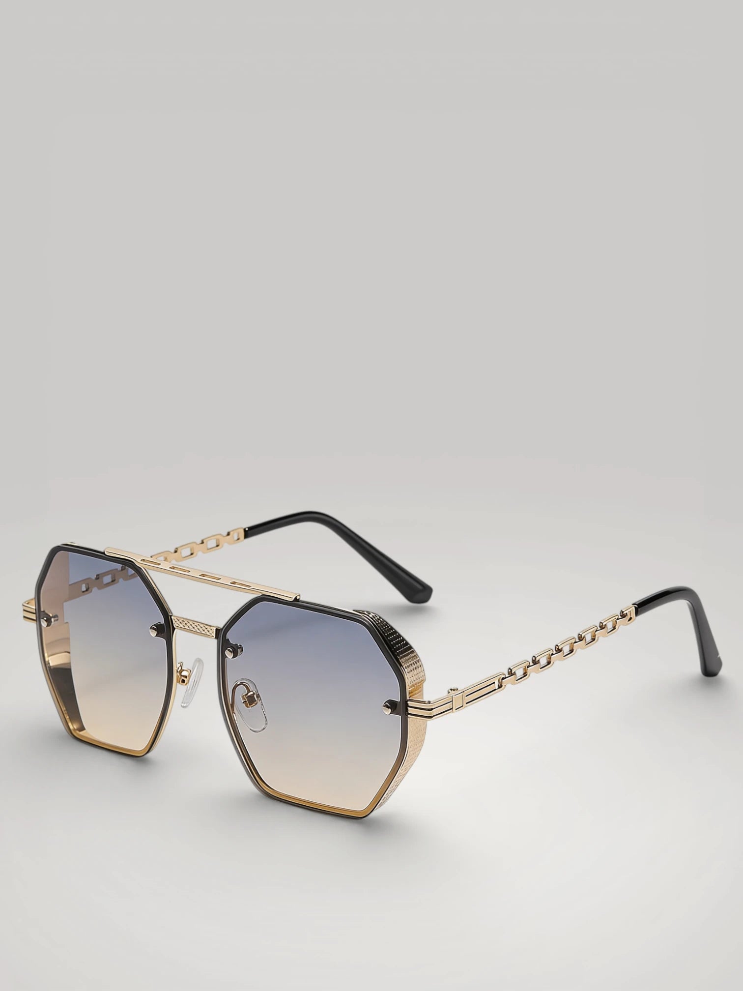 Lunettes de soleil unisexes avec chaîne élégante, coloris exclusif Or Bleu Soleil avec monture dorée et verres teintés.