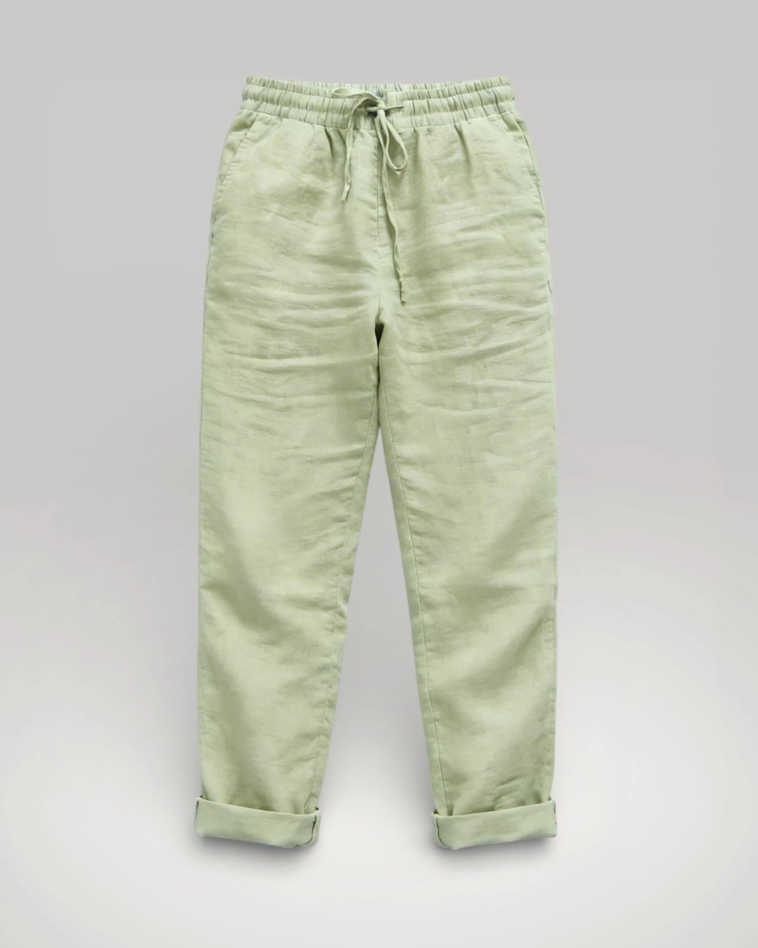 Vue de face du pantalon fluide pour femme couleur sable, mettant en évidence la taille haute et le cordon de serrage.