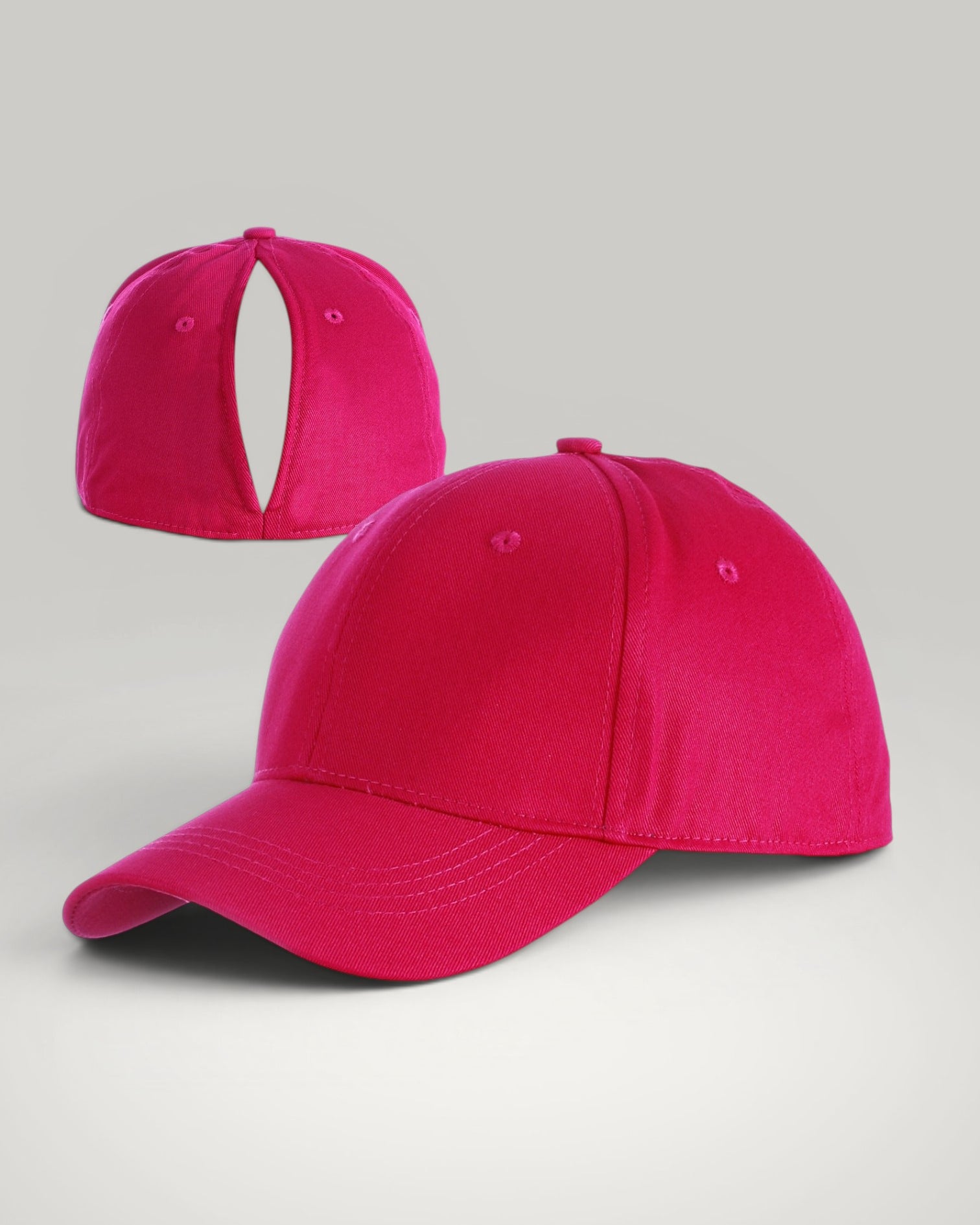 Urbain Couture roze katoenen paardenstaart pet met magnetische sluiting en open achterkant voor haarstijlen.