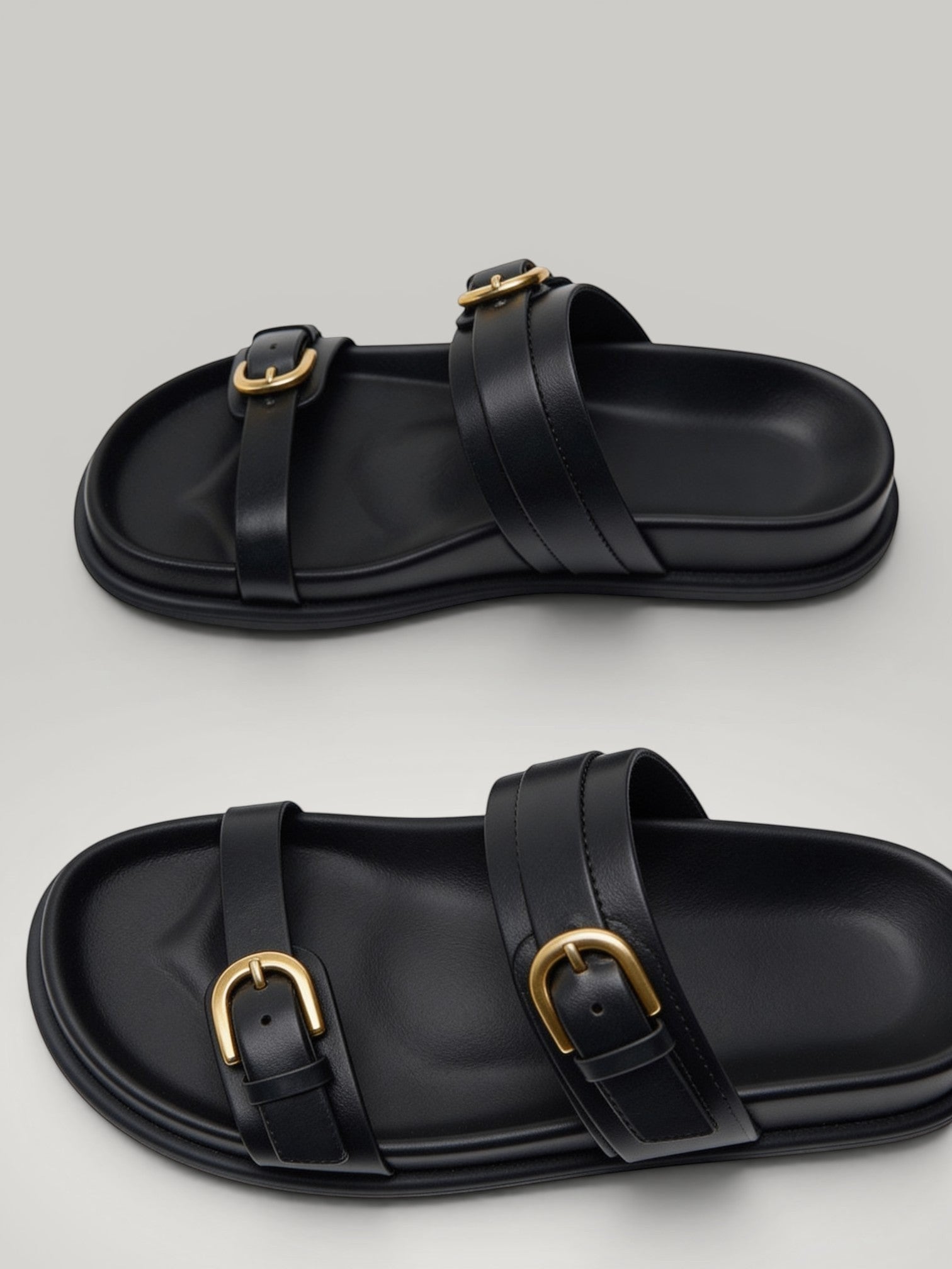 Urbain Couture black vegan leather slide sandals with double gold buckles and thick soles.