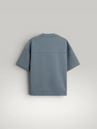 Urbain Couture blue textured double-face fabric oversized t-shirt with wide sleeves and ribbed hem.