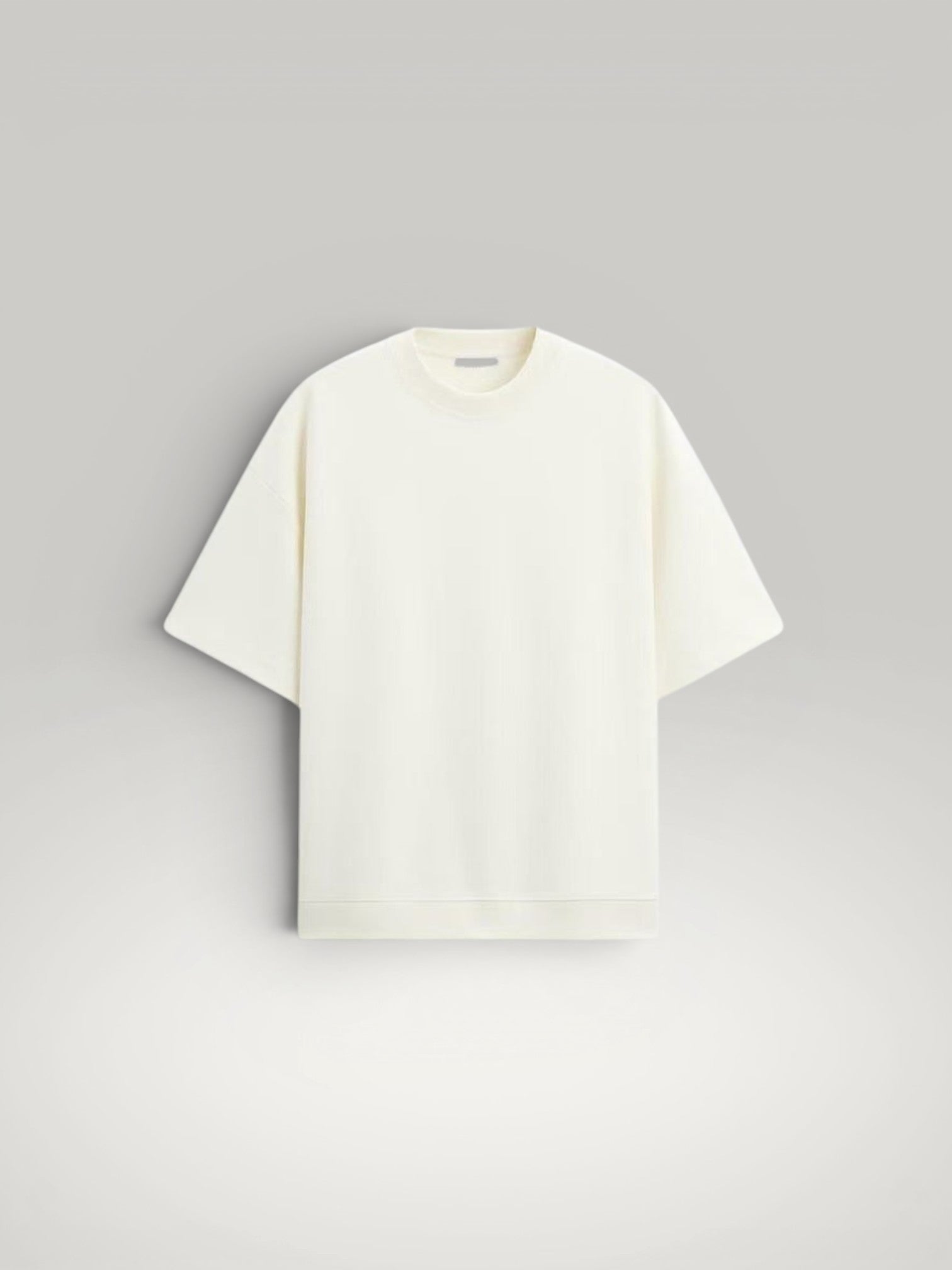 Urbain Couture cream oversized t-shirt with textured fabric and wide short sleeves. Minimalist summer style.