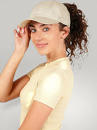 Urbain Couture beige katoenen paardenstaart pet met magnetische sluiting, ideaal voor sport en vrije tijd.